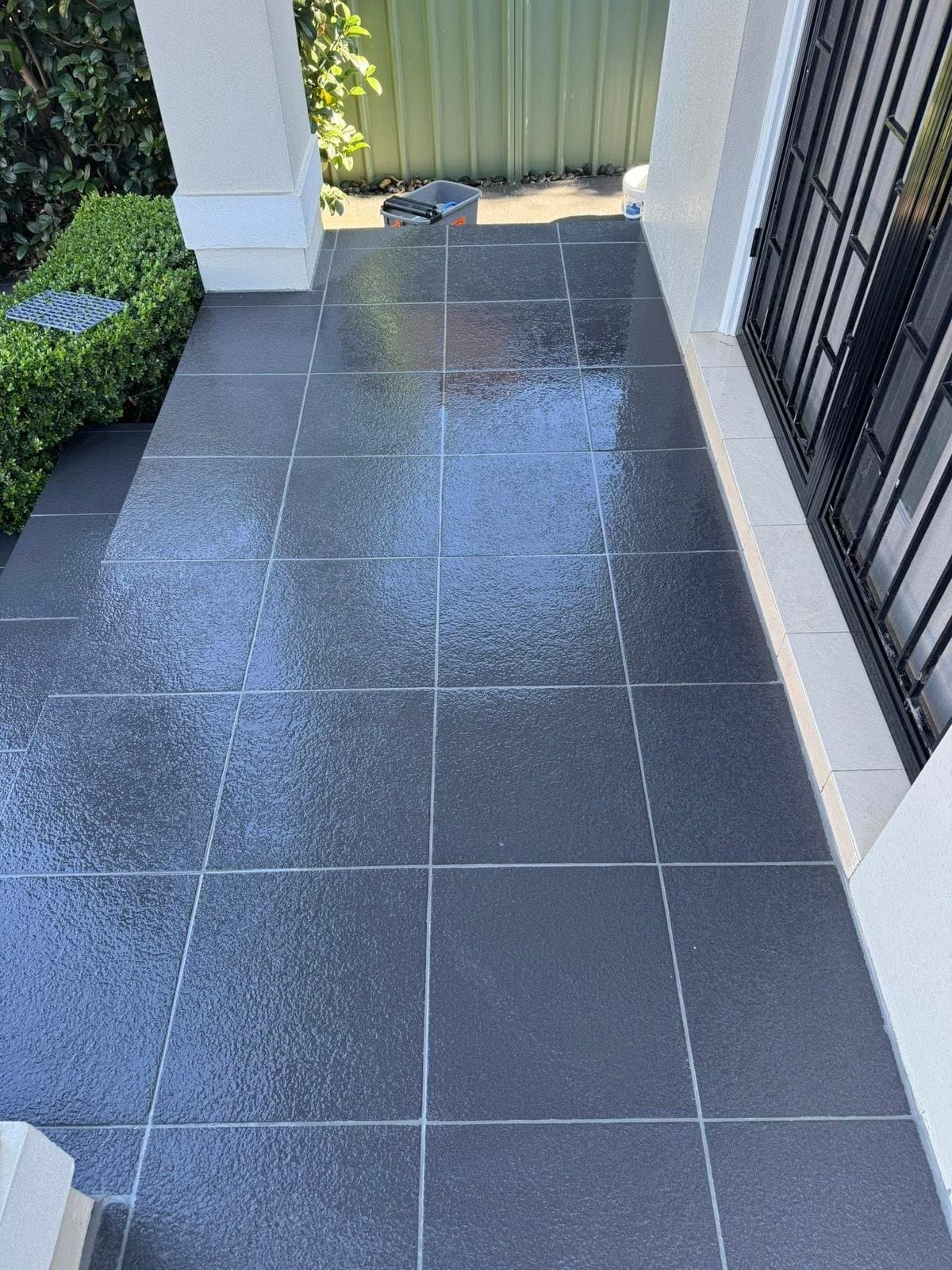 The same balcony with the grout lines clean and intact