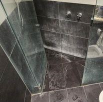 A shower in need of waterproofing and repair by Seal Masters.